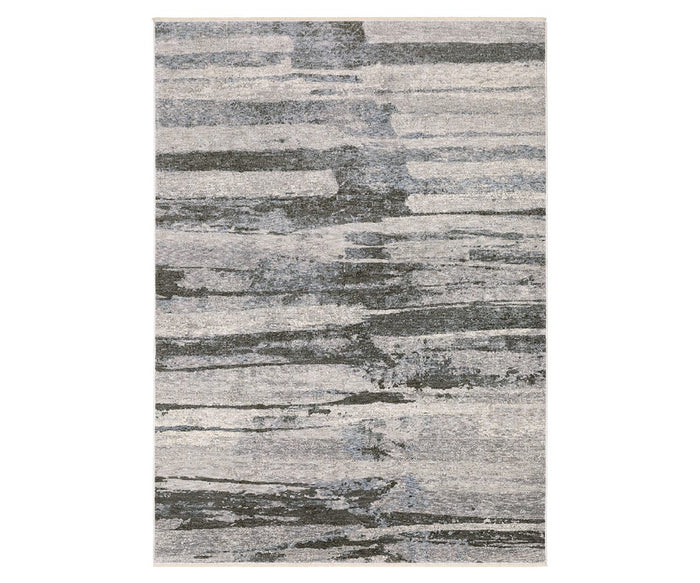 The Oriental Weavers Hayden HAY07 Rug in Grey/Multi features a modern abstract design with irregular horizontal lines reminiscent of brushstrokes or layered stone textures. Crafted from space-dyed polyester, this rectangular area rug showcases a sophisticated blend of gray, blue, and cream tones for a distinctive contemporary look.