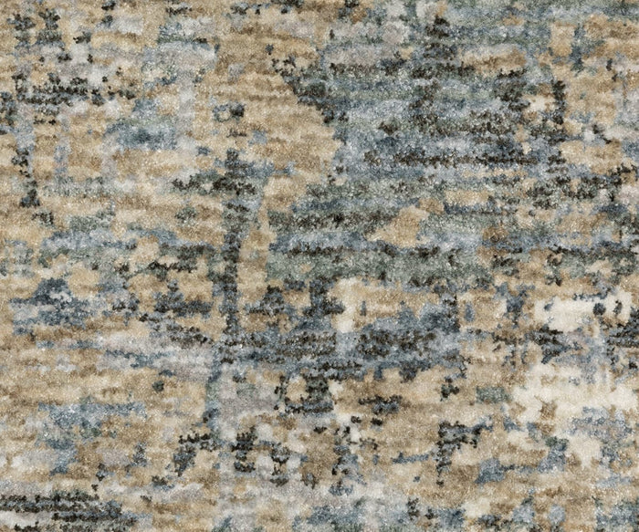 Close-up of the Oriental Weavers Hayden / HAY08 Rug, showcasing its textured surface with a blend of beige, blue, gray, and brown hues in an abstract mottled pattern. This rug features an abstract design rug style and is crafted from space-dyed polyester for added depth and visual interest.
