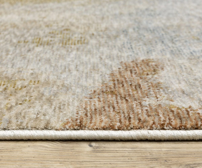 Close-up side view of the Oriental Weavers Hayden / HAY09 Rug on a wooden floor, highlighting its low pile texture, tightly bound edge, and the subtle abstract design characteristic of this space-dyed polyester rug.