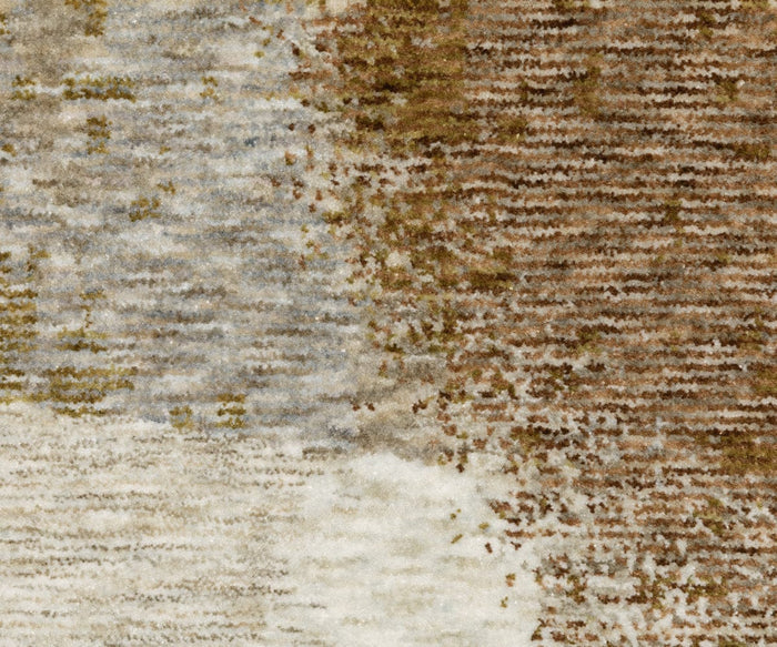 Close-up view of the Oriental Weavers Hayden / HAY09 Rug, featuring an abstract design where brown, beige, cream, and gray shades blend seamlessly in space-dyed polyester fibers to create a beautifully mottled texture.