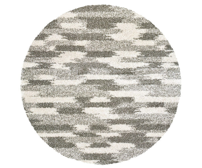 The Oriental Weavers Henderson / 565J Rug is a round area rug featuring an abstract, cloud-like pattern in a multi-colored palette. Inspired by modern geometric designs, its irregular shapes and varied tones create a soft, contemporary look for any space.