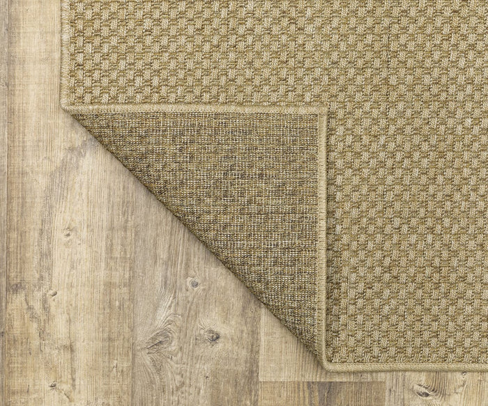 The Oriental Weavers Karavia / 2160X Rug, featuring a beige textured and durable woven design with one corner flipped over to show its underside, is displayed on a light-colored wooden floor.