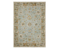 The Oriental Weavers Maeve / MAE06 Rug in Beige/Multi showcases a rectangular Persian-inspired design, featuring a light blue center adorned with intricate floral patterns and a wide olive-green border with matching motifs. Crafted from space dyed polypropylene, this boho rug offers vibrant style and lasting durability for any room.