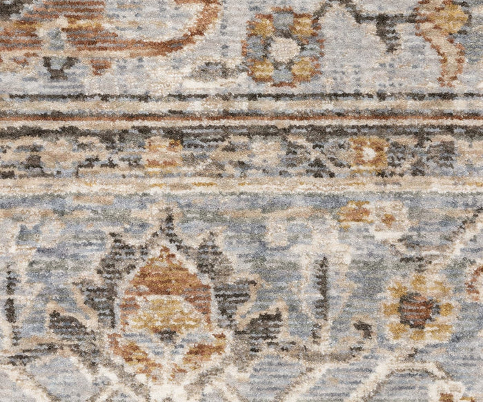 Close-up of the Oriental Weavers Maharaja / 1803X Rug, showcasing Persian-inspired floral and geometric patterns in shades of blue, beige, brown, and gold with a soft, textured surface.