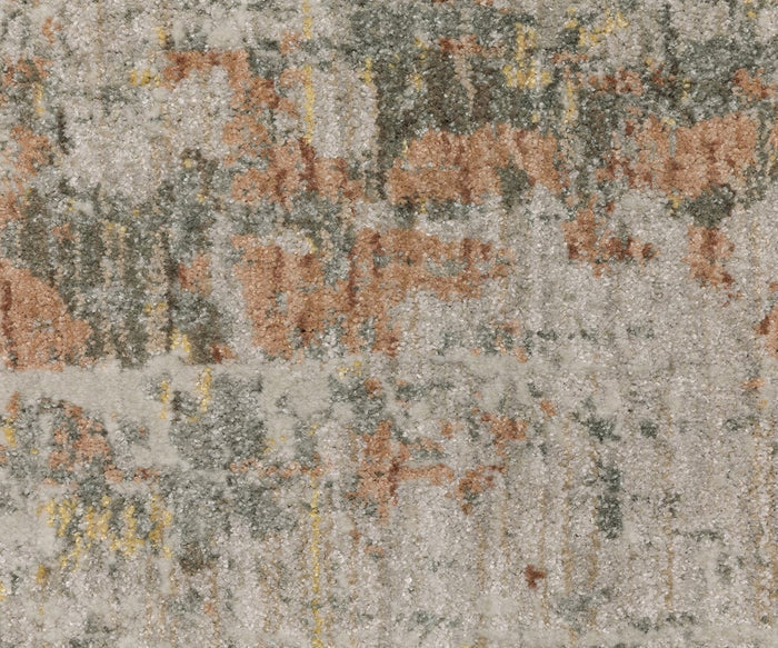 A close-up of the Oriental Weavers Mallory / MAL05 Rug showcases its textured surface and abstract design in muted orange, gray, white, and yellow tones. Crafted from space-dyed polypropylene, this rug offers earthy shades along with lasting beauty and durability.