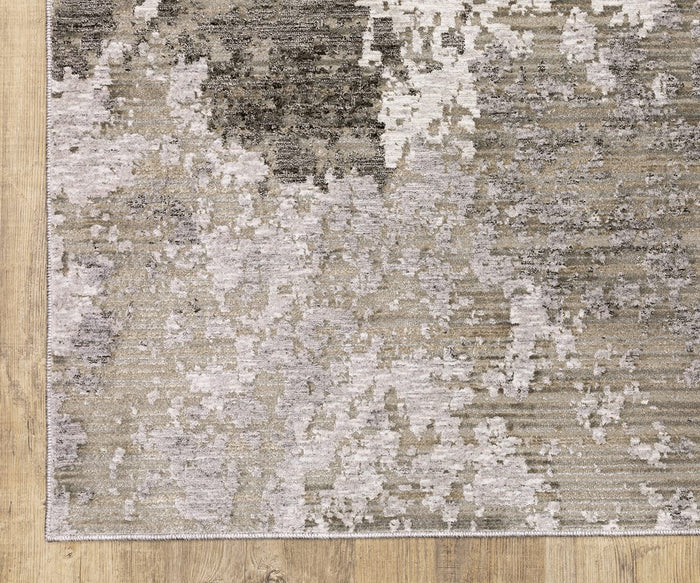 A close-up of the Oriental Weavers Nebulous / 5091E Rug—a rectangular area rug featuring an abstract, textured pattern in shades of beige, gray, and cream—woven from soft polyester yarn and displayed on a light wood floor; a striking example from the modern Nebulous Collection.