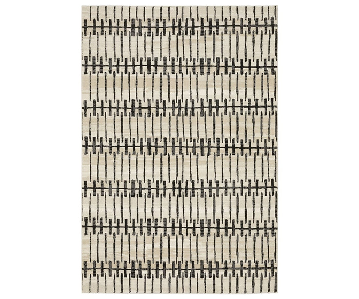The Oriental Weavers Raylan / RAY11 Rug in White/Multi features a rectangular shape with a white background and a modern geometric motif formed by short black horizontal and vertical lines. This fade-resistant rug adds contemporary style to any room.
