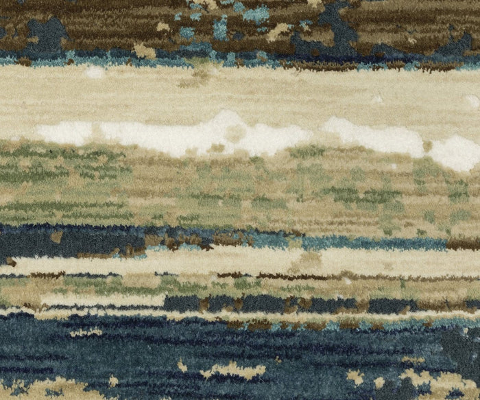 Bring an artistic touch to your space with the Oriental Weavers Reed / RE02A Rug, featuring abstract horizontal brushstrokes in soft hues of beige, green, blue, and brown that evoke a blurred landscape or watercolor artwork. Crafted from space-dyed polypropylene for lasting durability and luxurious softness, this textured rug is a perfect addition to any modern room.