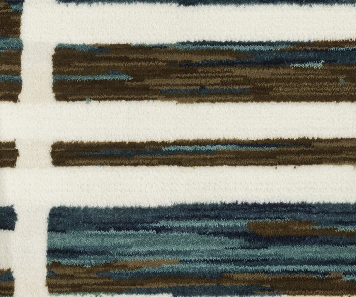 A close-up of the Oriental Weavers Reed / RE05A Rug reveals a soft, textured surface featuring horizontal brown and blue lines on a cream background, forming an abstract striped pattern. Crafted from space-dyed polypropylene, this rug enhances any room with its unique combination of color and comfort.