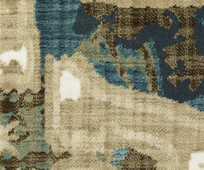 An abstract close-up of the Oriental Weavers Reed / RE11Q Rug showcases a textured fabric with a pattern in shades of beige, brown, blue, and white. The random, organic design evokes the feel of a landscape or camouflage, perfectly reflecting contemporary style. Crafted using power-loomed techniques with space dyed polypropylene, this rug offers both durability and vibrant color variation for an artistic modern look.