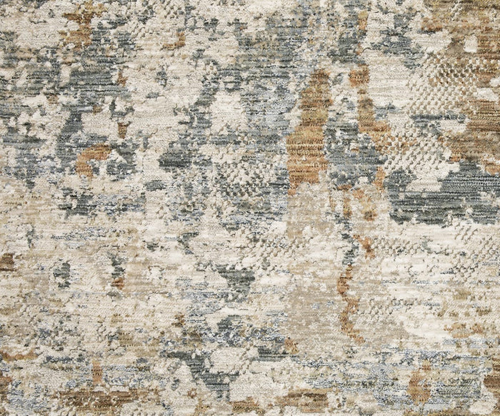 A close-up of the Oriental Weavers Soho / SOH08 Rug, featuring space-dyed polyester yarns in a blend of beige, gray, blue, and brown abstract shapes and textures for a modern, weathered look—an elegant decor choice for any room.