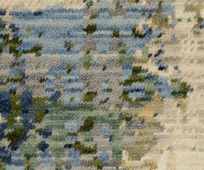 Close-up of the Oriental Weavers Soleri / SOL01 Rug, featuring a textured surface with an abstract pattern in blue, green, beige, and cream tones reminiscent of watercolor or impressionist art—an ideal modern abstract rug expertly crafted on an Axminster loom.