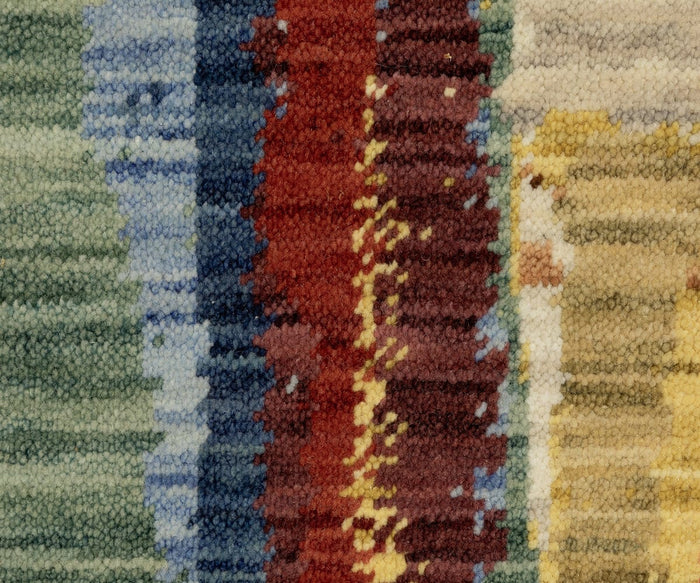 Close-up of the Oriental Weavers Soleri / SOL02 Rug—a textured, multicolored woven fabric featuring vertical stripes in green, blue, red, yellow, and beige shades—highlighting its detailed fibers and intricate blending patterns.