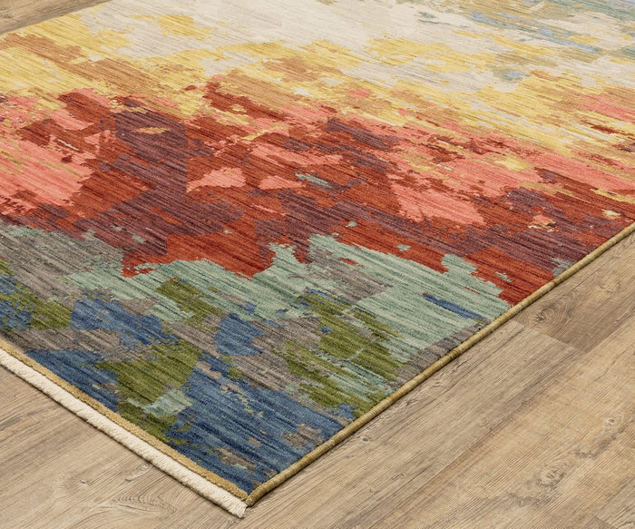 The Oriental Weavers Soleri / SOL04 Rug showcases a modern abstract pattern in vibrant red, yellow, green, and blue hues on a rectangular design, displayed atop a light wood floor. Expertly crafted from premium wool and nylon, this rug brings contemporary flair to any space.