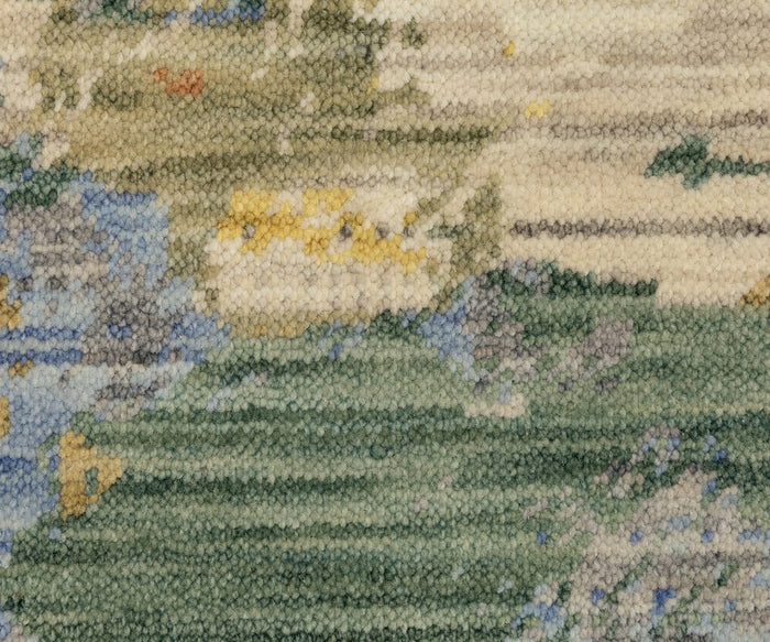 Close-up of the Oriental Weavers Soleri / SOL04 Rug, showcasing its textured woven tapestry with abstract patterns in green, blue, yellow, and beige tones that evoke a natural landscape; this modern rug is expertly crafted from a premium wool and nylon blend.