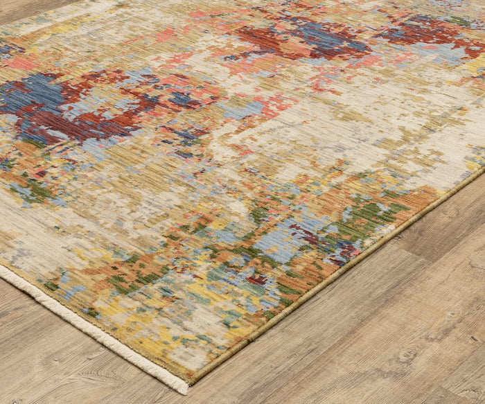 A close-up of the Oriental Weavers Soleri / SOL06 Rug, crafted on an Axminster loom, showcases its abstract, multicolored pattern in shades of blue, red, yellow, and beige atop a wooden floor. This modern rug is made from a durable blend of wool and nylon for both softness and longevity.