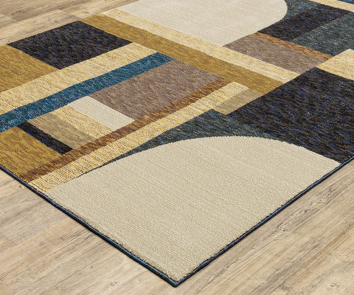 The Oriental Weavers Strada / STR01 Rug is a modern area rug featuring overlapping rectangles and arches in beige, brown, blue, and gold tones. Machine-woven from nylon with textured patterns, it adds a contemporary touch atop wooden floors.