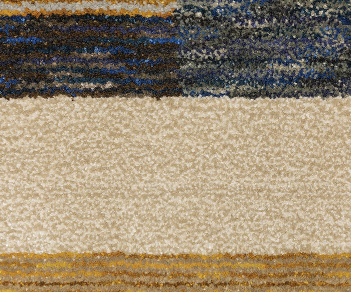 A close-up of the Oriental Weavers Strada / STR01 Rug showcases its textured, machine-woven nylon surface with horizontal stripes in cream, beige, blue, brown, and yellow. Drawing inspiration from Art Deco design, this area rug features a striking pattern of alternating thick and thin bands for a bold and modern look.