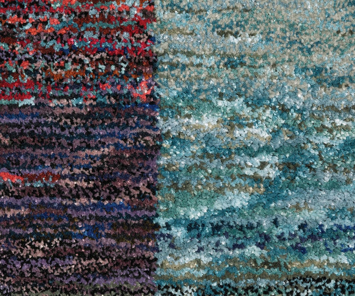 A close-up of the Oriental Weavers Strada / STR04 Rug showcases its textured, multicolored design—reminiscent of an Art Deco rug—divided into four sections: red and blue hues in the top left, blues in the top right, dark purples and reds on the bottom left, and teal with blue tones on the bottom right. Its machine-woven nylon construction ensures both vibrant style and lasting durability for modern spaces.