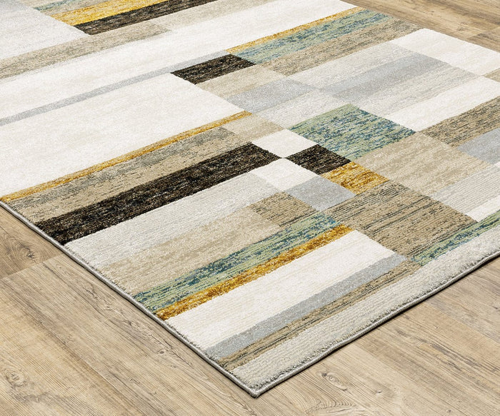 The Oriental Weavers Strada / STR07 Rug—a rectangular, machine-woven nylon area rug in a modern geometric pattern featuring shades of beige, white, yellow, black, and green—rests on a light wood floor, making it an ideal choice for contemporary spaces that value both style and durability.