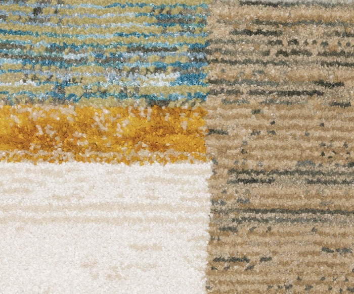 Close-up of the Oriental Weavers Strada / STR07 Rug, a machine-woven nylon carpet featuring a textured surface with horizontal stripes in blue, mustard yellow, beige, brown, and white that form a modern geometric pattern—an ideal choice for contemporary spaces.