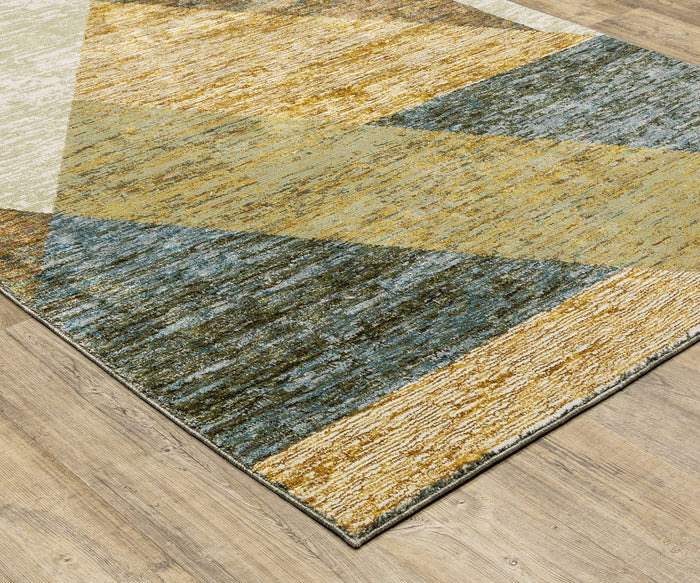 A close-up of the Oriental Weavers Strada / STR09 Rug—a machine-woven nylon rug featuring geometric patterns in yellow, blue, and beige—placed on a light wood floor.