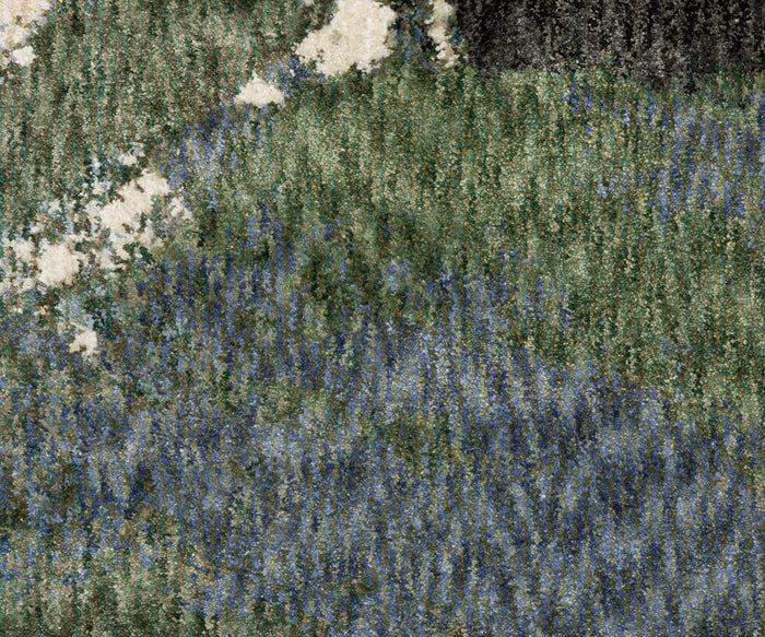 A textured abstract image with patches of green, blue, white, and black, reminiscent of a landscape featuring grass, water, and rugged terrain. The colors are mottled and blended throughout the image, much like the striking patterns found in the Oriental Weavers Tisdell / TIS04 Rug crafted from durable polyester.