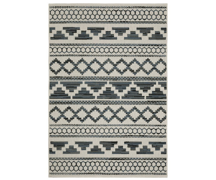 The Oriental Weavers Torrey / 005Y1 Rug in Grey/Multi is a rectangular area rug from the Torrey Collection, showcasing geometric patterns with repeating diamond and zigzag shapes arranged in horizontal rows. Its dynamic texture evokes abstract motifs, making it a striking addition to any space.