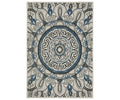 The Oriental Weavers Torrey / 072J1 Rug is a multi-colored area rug from the Torrey Collection, showcasing a symmetrical mandala pattern with circular and floral motifs, intricate swirls, and leaf designs in neutral tones on a cream background.