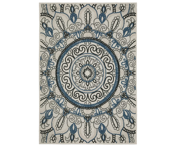 The Oriental Weavers Torrey / 072J1 Rug is a multi-colored area rug from the Torrey Collection, showcasing a symmetrical mandala pattern with circular and floral motifs, intricate swirls, and leaf designs in neutral tones on a cream background.