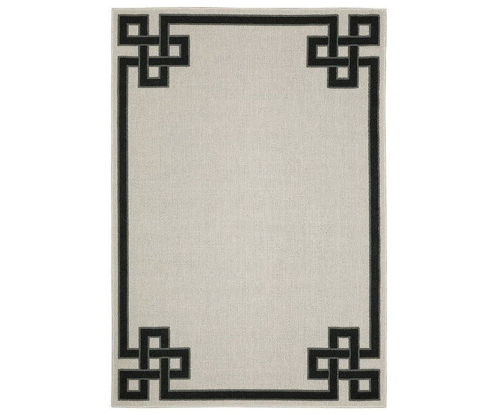 Oriental Weavers Torrey / 1530I Rug in White/Multi features a rectangular design with a black geometric border pattern at each corner, showcasing interlocking square shapes and subtle abstract motifs; the central area remains plain for a balanced yet dynamic texture.