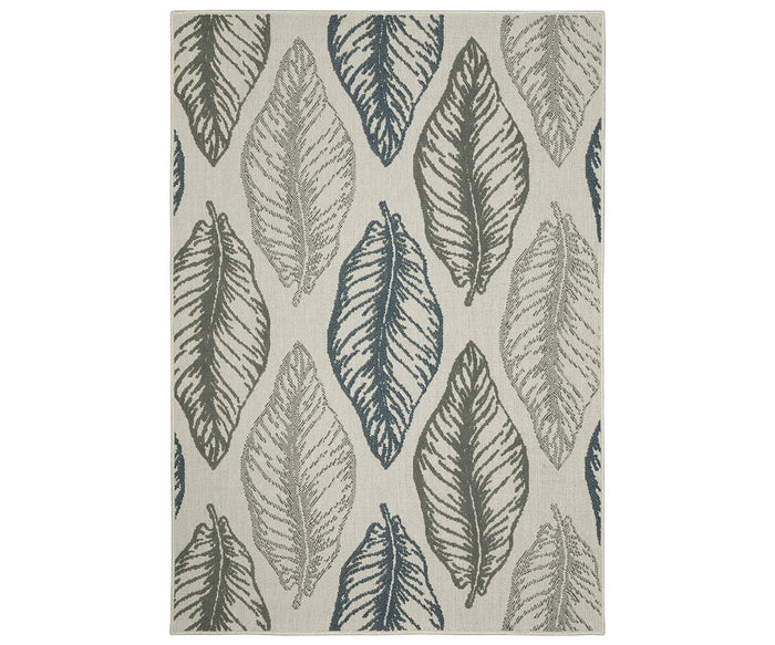 The Oriental Weavers Torrey / 5570Y Rug in Grey/Multi features a rectangular shape with a pattern of large, overlapping leaves in shades of gray, blue, and green on a light beige background. The leaf designs are arranged in vertical rows and vary in shading and outline style, giving the rug a layered, textured appearance throughout.