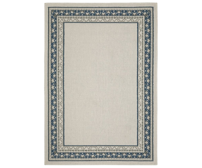 Oriental Weavers Torrey / 8020W Rug in a multi-color palette from the Torrey Collection, featuring a rectangular shape with a simple blue patterned border adorned with repeating geometric and leaf-like motifs, and a plain center that adds subtle dynamic texture to any space.