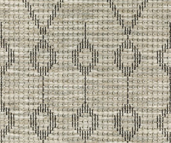 Close-up of the Oriental Weavers Tortuga / TR04A Rug, featuring a woven beige fabric accented by a geometric pattern of interconnected circles and lines in a slightly darker tone. The soft, detailed texture highlights the quality craftsmanship and global inspiration characteristic of this rug.