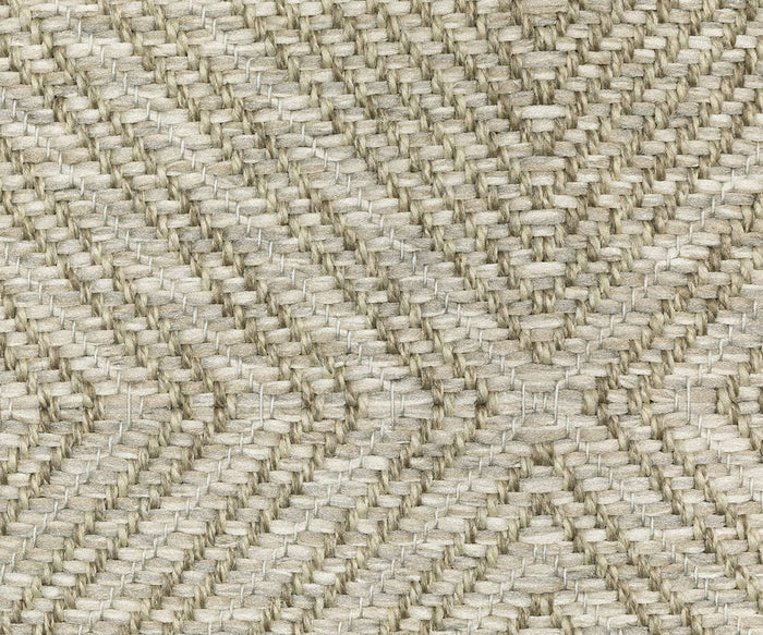 Close-up of a beige woven fabric with a herringbone pattern, featuring intersecting diagonal lines and textured fibers—part of the Oriental Weavers Tortuga / TR05A Rug, this easy-care polypropylene piece combines durability with timeless style.