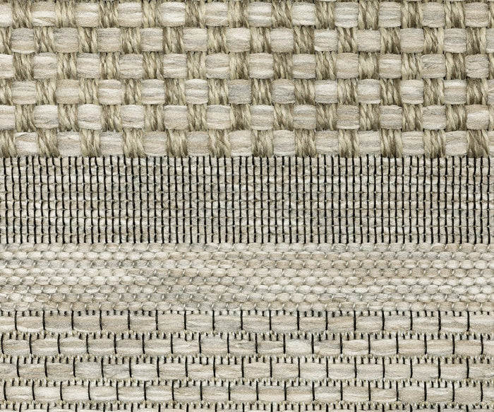The Oriental Weavers Tortuga / TR06A Rug features four horizontal bands of woven textile, each showcasing distinct beige and gray patterns and textures inspired by the Tortuga Collection. Crafted from durable polypropylene, this easy-care rug combines visual interest with practical everyday use.