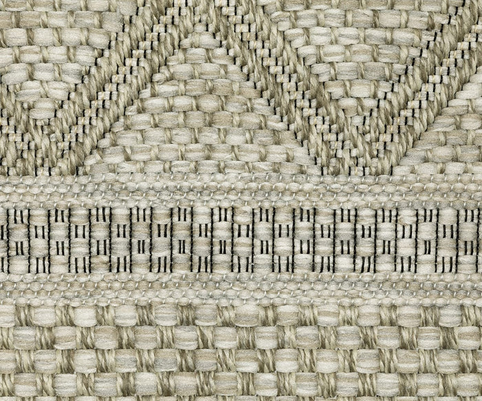 A close-up of the Oriental Weavers Tortuga / TR10A Rug showcases woven geometric patterns in beige and cream, including chevrons, horizontal stripes, and squares, expertly crafted as a power-loomed rug from durable polypropylene fibers.
