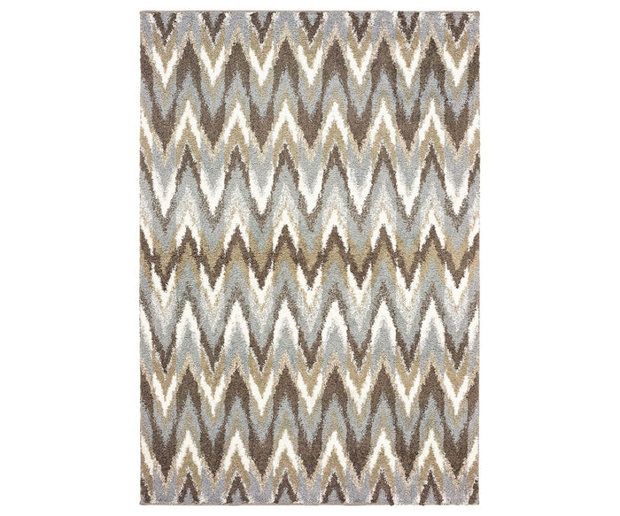 Oriental Weavers Verona / 4D Rug in Beige/Multi features a rectangular shape with a zigzag chevron pattern in earthy tones. Made from soft polyester microfiber, this rug displays a vertically repeating design for a modern and dynamic appearance.