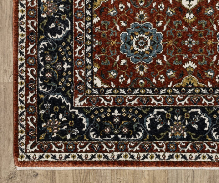 Close-up of the Oriental Weavers Vivian / VI04B Rug, featuring red, navy, and cream hues with intricate Persian-inspired floral designs, displayed on a wooden floor. This area rug showcases a traditional color palette that brings timeless elegance to any space.