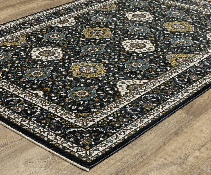 The Oriental Weavers Vivian / VI04C Rug, featuring an intricate floral and geometric pattern in blue, gold, white, and beige tones with a decorative border and dark background reminiscent of Persian-inspired designs, sits on a light wood floor and highlights the traditional color palette.