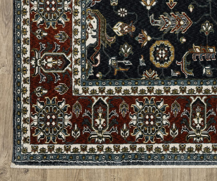 A close-up of the Oriental Weavers Vivian / VI05A Rug showcases its Persian-inspired design with a red border and intricate floral and geometric patterns in cream, blue, and black tones, crafted from soft microfiber polyester and displayed on a light wooden floor.