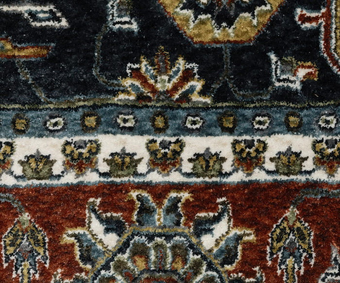 A close-up of the Oriental Weavers Vivian / VI05A Rug highlights its abstract floral motifs in red, white, dark blue, olive, and beige tones. Made from microfiber polyester, this design showcases symmetrical flowers and decorative bands inspired by traditional Persian rugs.