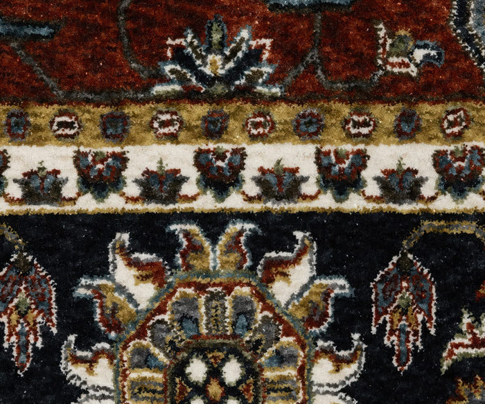 Close-up of the Oriental Weavers Vivian / VI05X Rug featuring intricate floral and geometric patterns in red, navy, white, and gold. The texture of the microfiber polyester fibers and the detailed borders are clearly visible, highlighting a traditional color palette characteristic of this Persian-inspired design.