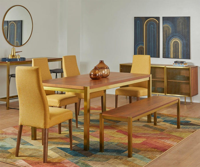 Modern dining room with a wooden table, yellow upholstered chairs, a bench, colorful rug, and abstract wall art. A sideboard topped with the Oval Lacquer Tray, a mirror, and decorative vases completes the space.