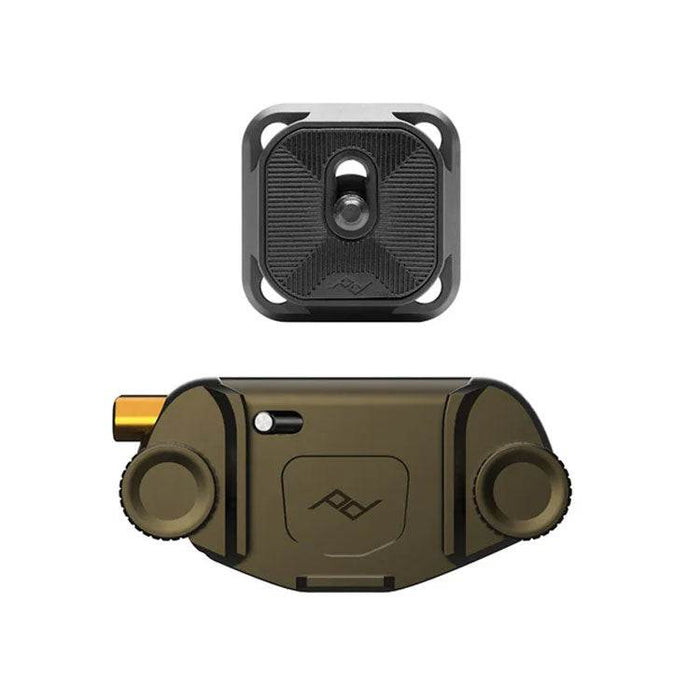 Peak Design Capture Camera Clip securely holding a camera on a backpack strap with quick-release button