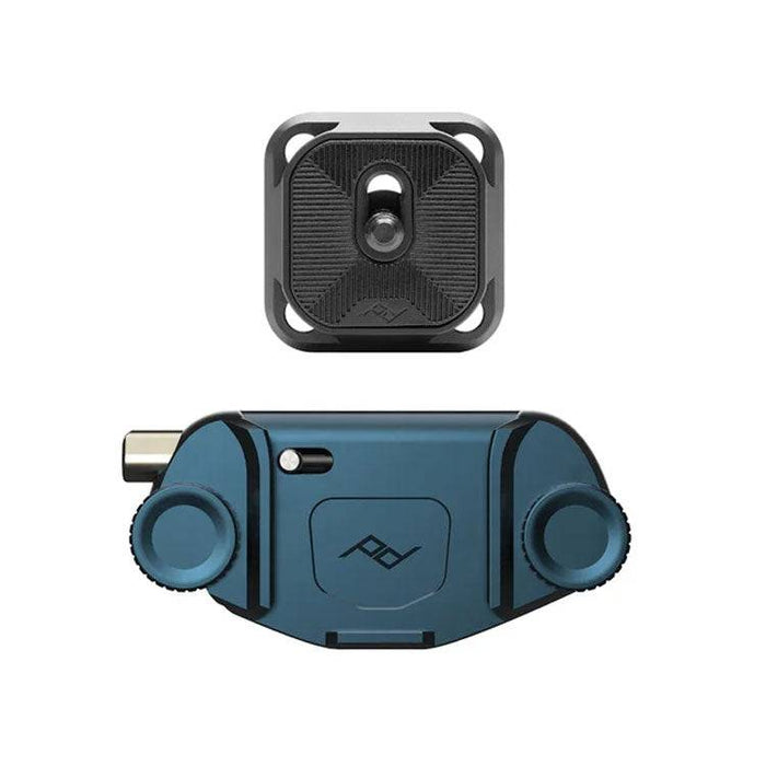 Peak Design Capture camera clip securely attached to backpack strap with camera mounted using Arca tripod-compatible plate