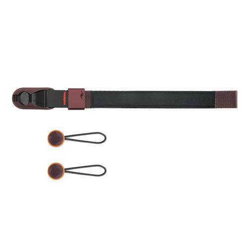 Peak Design Cuff wrist strap attached to camera with aluminum hardware and durable nylon webbing