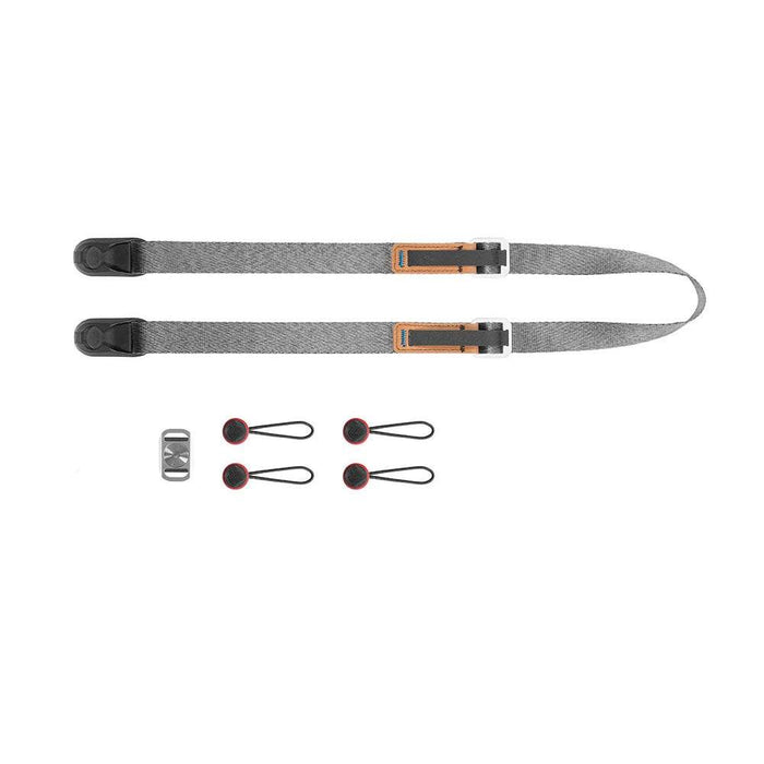 Peak Design Leash camera strap with quick-adjusters and Anchor Link connectors laid out flat with attachments.
