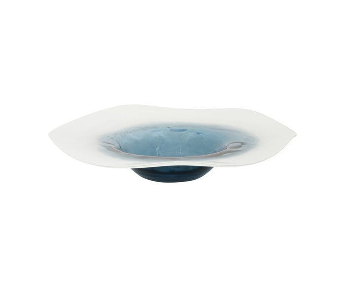 The Polar Frost Bowl, in a striking blue and multi-color design, features a shallow glass silhouette with a wide, wavy white rim and deep blue center. Hand-finished for exceptional craftsmanship, it makes an eye-catching decorative piece—especially when displayed against a plain white background.