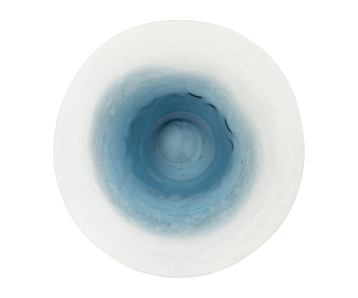 A top-down view of the Polar Frost Bowl, showcasing its gradient blue interior and white rim, gives it an abstract, vortex-inspired look.